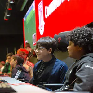 Children playing a computer game in the sports arena