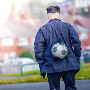 Young man walking away from the camera