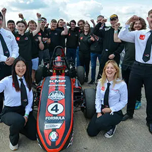 Staffordshire University students pictured surrounding their racing car