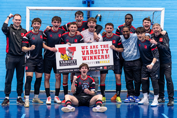 The Futsal team celebrating their Varsity win