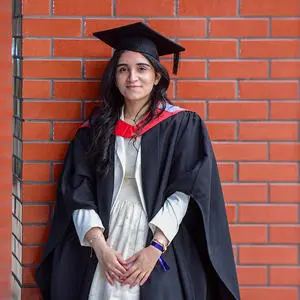 Huda Fatima in her graduation cap and gown