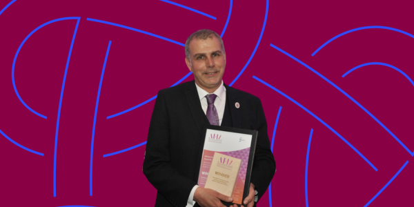 Ian Davies MBE, pictured receiving his Biomedical Scientist of the Year Award in 2023