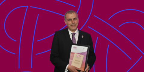 Ian Davies MBE, pictured receiving his Biomedical Scientist of the Year Award in 2023