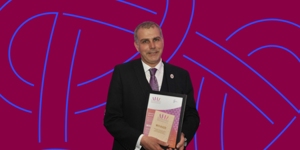 Ian Davies MBE, pictured receiving his Biomedical Scientist of the Year Award in 2023