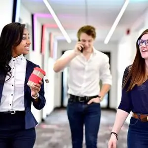 People in business clothes walking and talking
