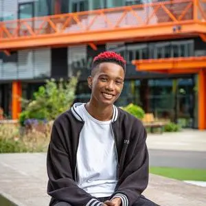 James Henry sat in front of the Here East campus