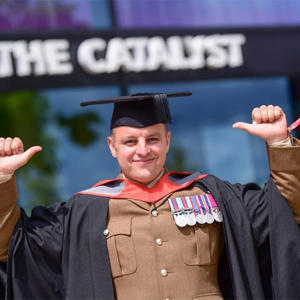 Jamie Duffill in his graduation cap and gown