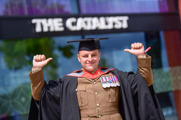 Jamie Duffill in his graduation cap and gown