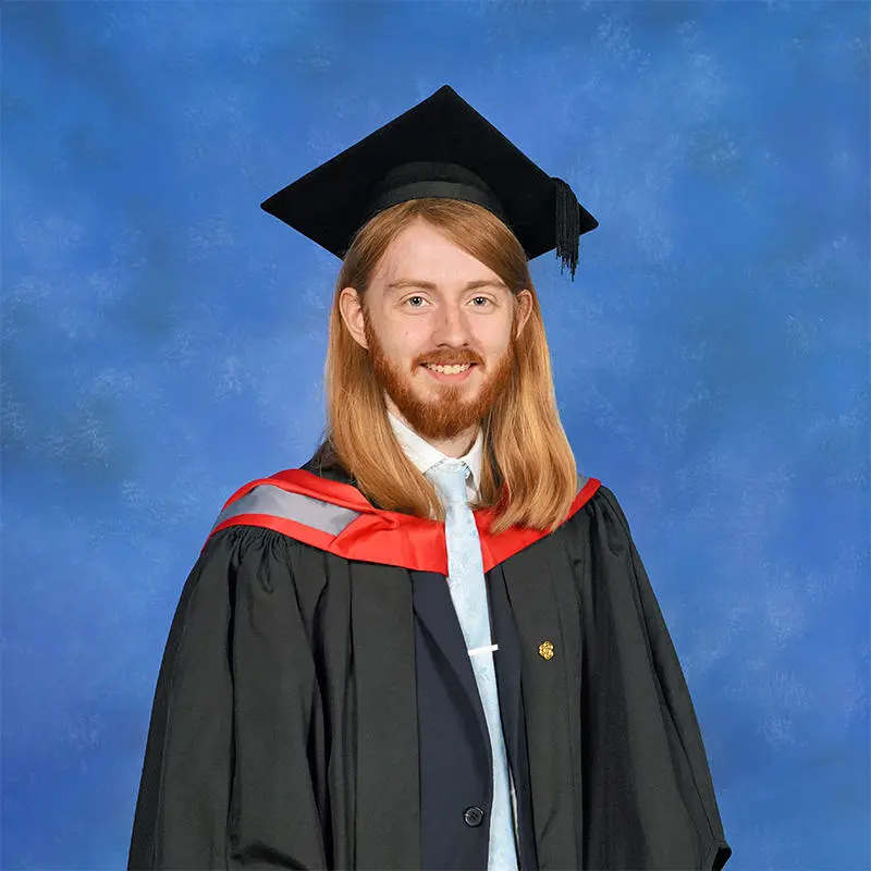 Jeremiah Hough in his graduation cap and gown