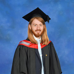 Jeremiah Hough in his graduation cap and gown