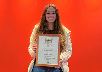 Jess Caldwell pictured with the bronze award certificate