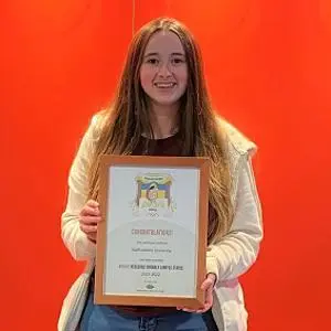 Jess Caldwell pictured with the bronze award certificate