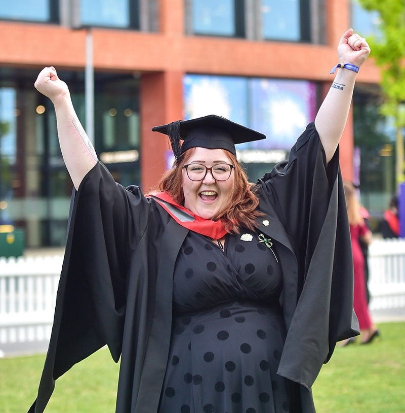 Jessica Rodgers in her graduation cap and gown 