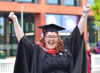Jessica Rodgers in her graduation cap and gown 