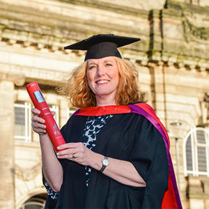 Julie Davies in her graduation cap and gown