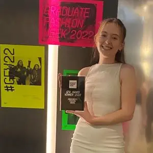 Louise Rutter holding her award