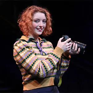 Maddie Hughes holding a camera