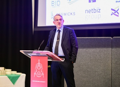 Man in suit at lectern