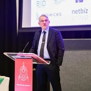 Man in suit at lectern