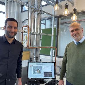 PhD researcher Hossein Sheykhpoor and Professor Hamidreza Gohari Darabkhani stood by the Micro Turbine 