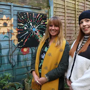 Claire Gwinnett and Laura Wilkinson next to one of the plastic artworks