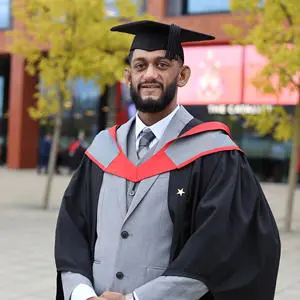Naser Rashid in his graduation cap and gown
