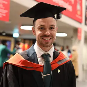 Nathan Coley in his graduation cap and gown
