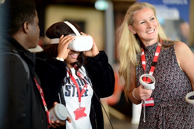 An image of students trying out VR at a fair