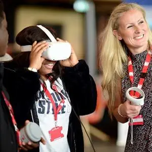 An image of students trying out VR at a fair