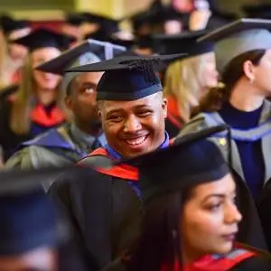 A group of students dressed for graduation