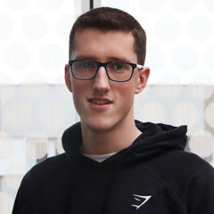 A male student wearing glasses.