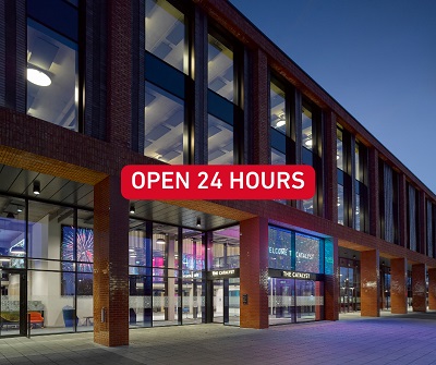 Image of Catalyst building at night with wording to advertise opening hours