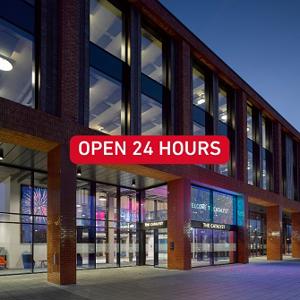 Image of Catalyst building at night with wording to advertise opening hours