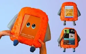 Orange furry PAT assistant character shown from three angles with a screen, arms and blue feet.