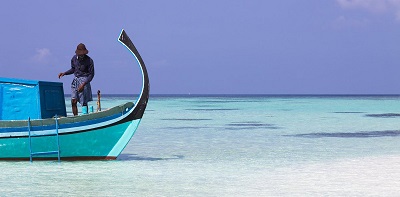 A fisherman on a boat in the Maldives