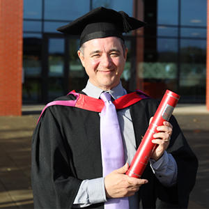 Peter Winters in his graduation cap and gown