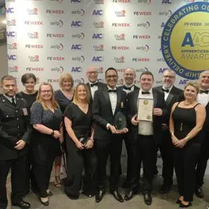 group of people stood holidng an award