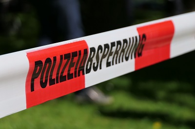 German crime scene tape reading 'polizeibsperung'