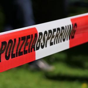 German crime scene tape reading 'polizeibsperung'
