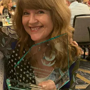 Prof Liz Boath pictured with her award