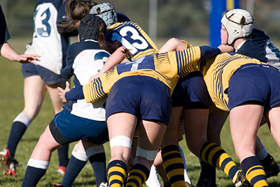 Female rugby players in a scrum