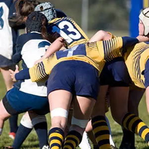 Female rugby players in a scrum