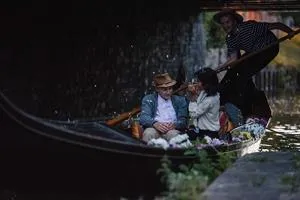 A screenshot from the film Running Naked of two characters enjoying a gondola ride