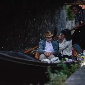 A screenshot from the film Running Naked of two characters enjoying a gondola ride