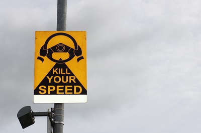A road sign saying 'kill your speed'