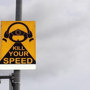 A road sign saying 'kill your speed'