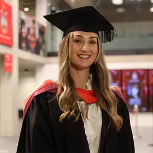 Stacie Chorlton-Lythgoe in her graduation cap and gown