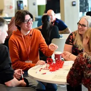 Prospective students talking to advisors in Staffordshire University's Clearing Hub