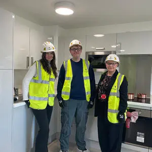 Students Lucy Hughes and Owen Ford with Christina Matthews during a site tour of the Student Village