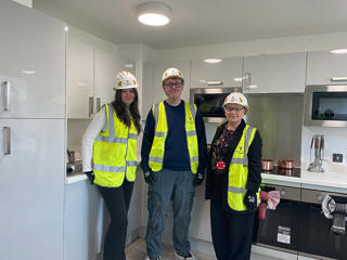 Students Lucy Hughes and Owen Ford with Christina Matthews during a site tour of the Student Village